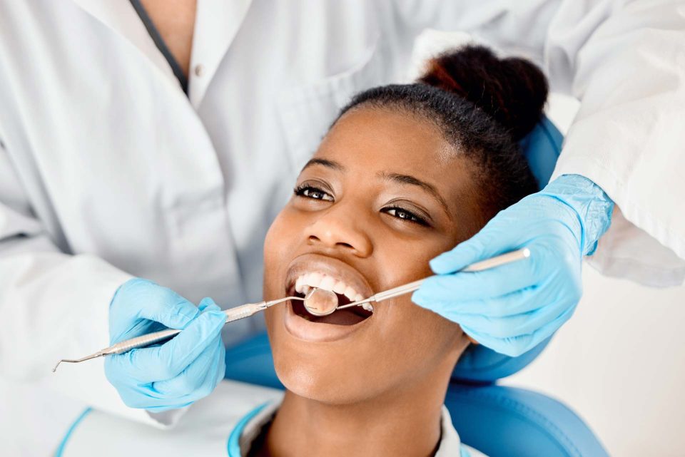 dental membership plan smiling woman at dentist